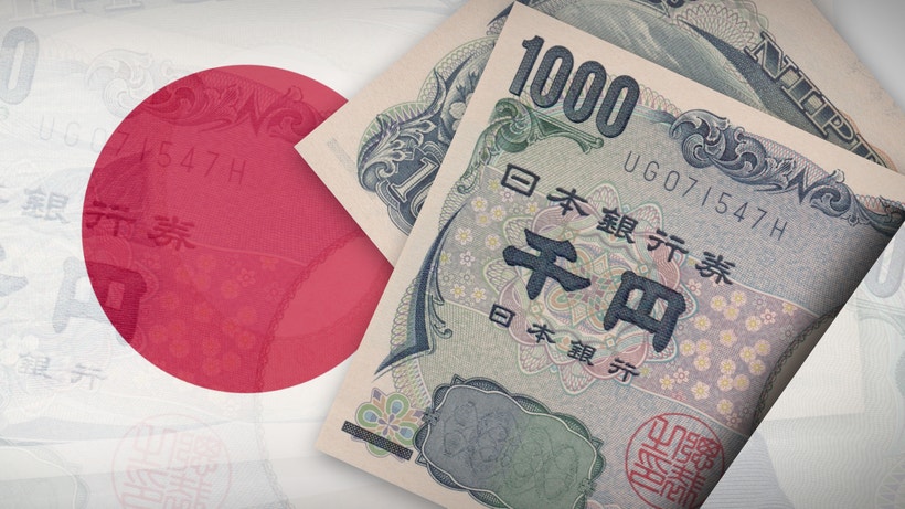 japanese yen and japanese flag overlayed
