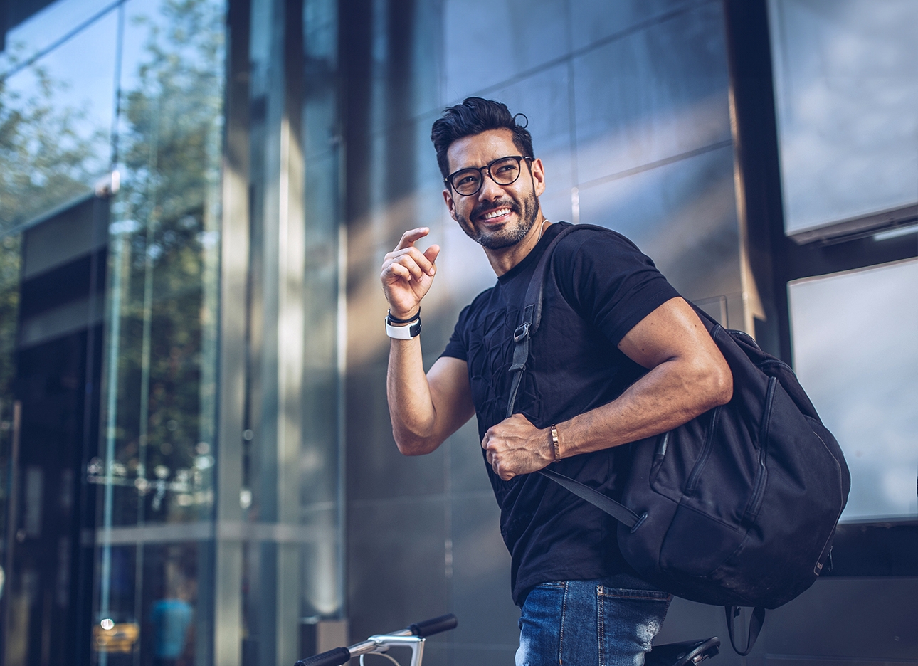 man smiling with backpack