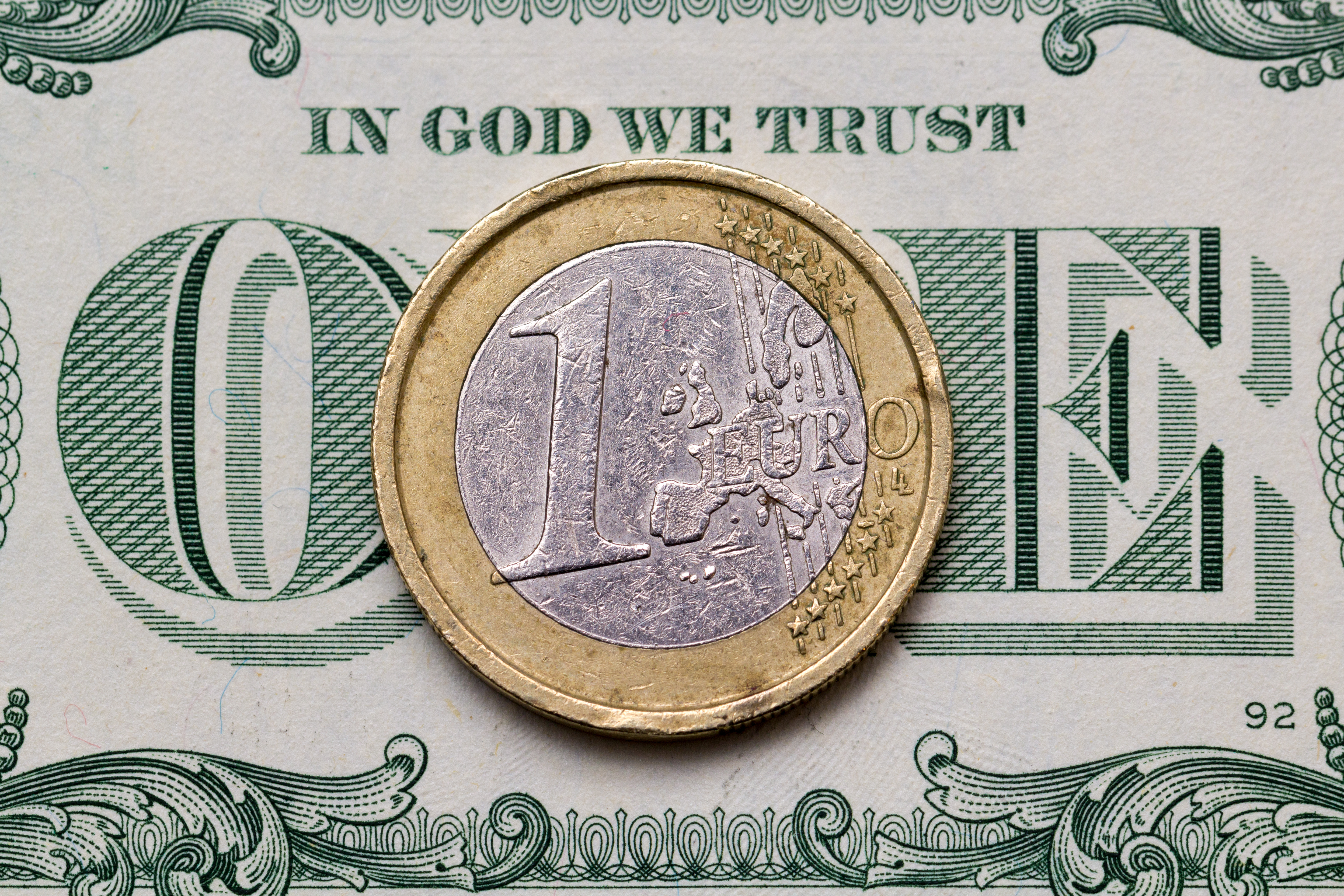 dollar bill and euro coin