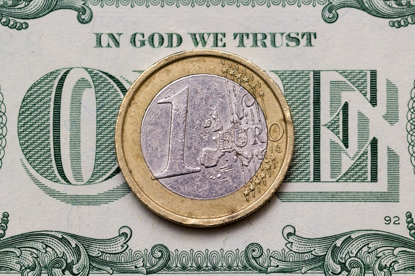 dollar bill and euro coin