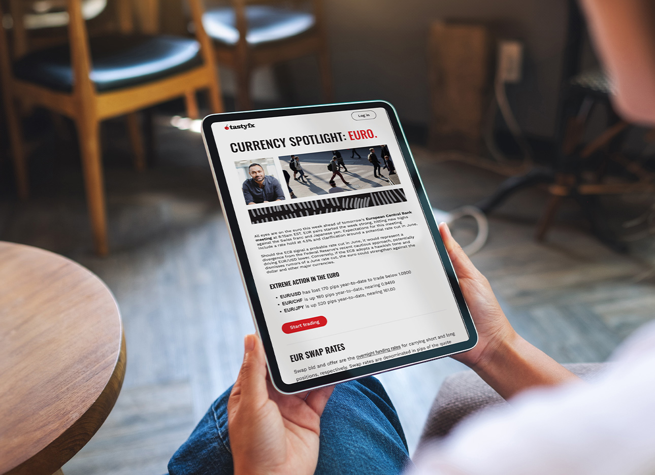 man holding ipad with a news article