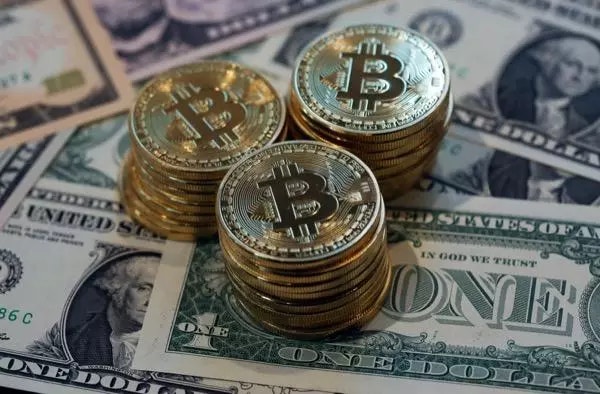 Bitcoins on US dollar bills