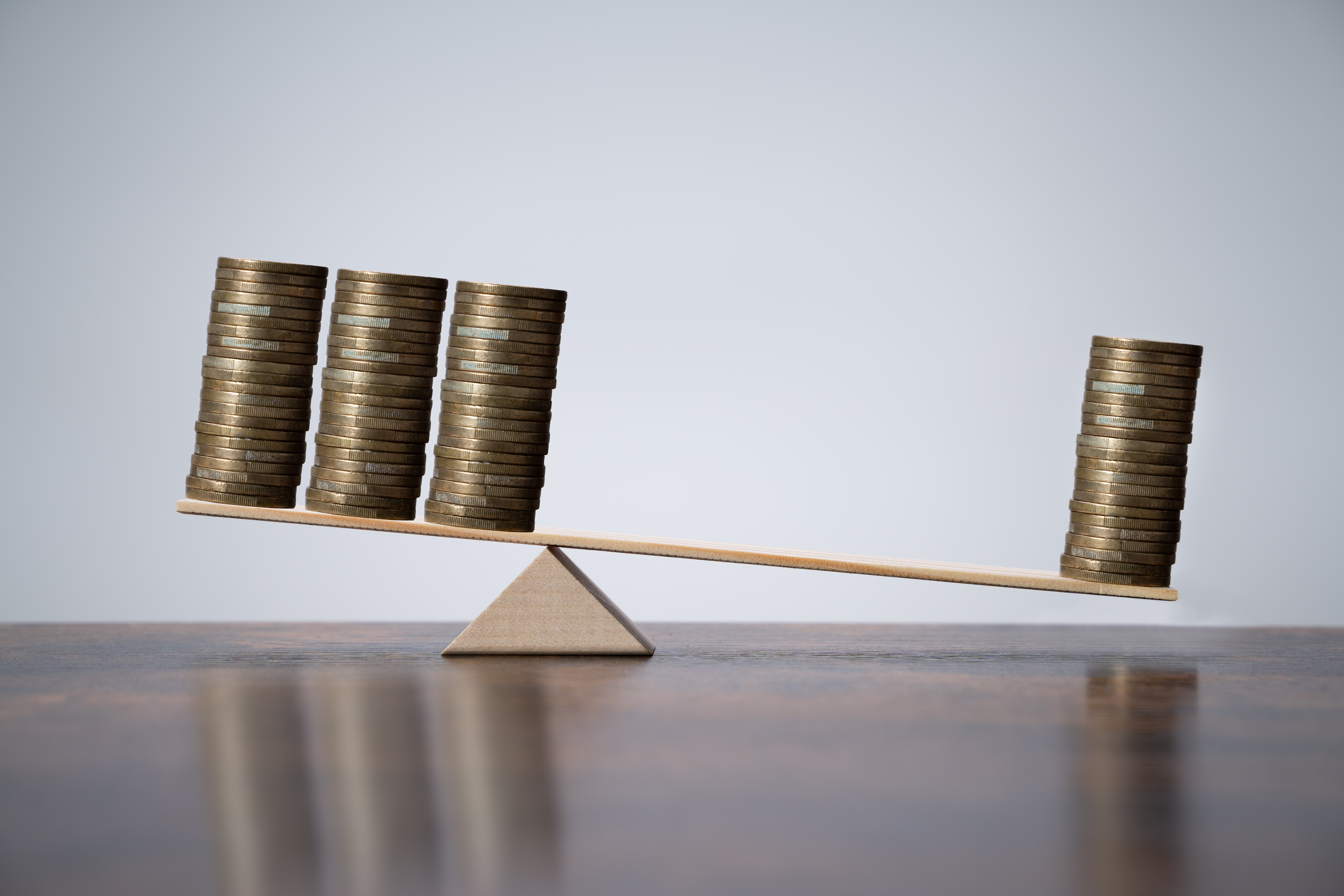 coins balancing on a scale