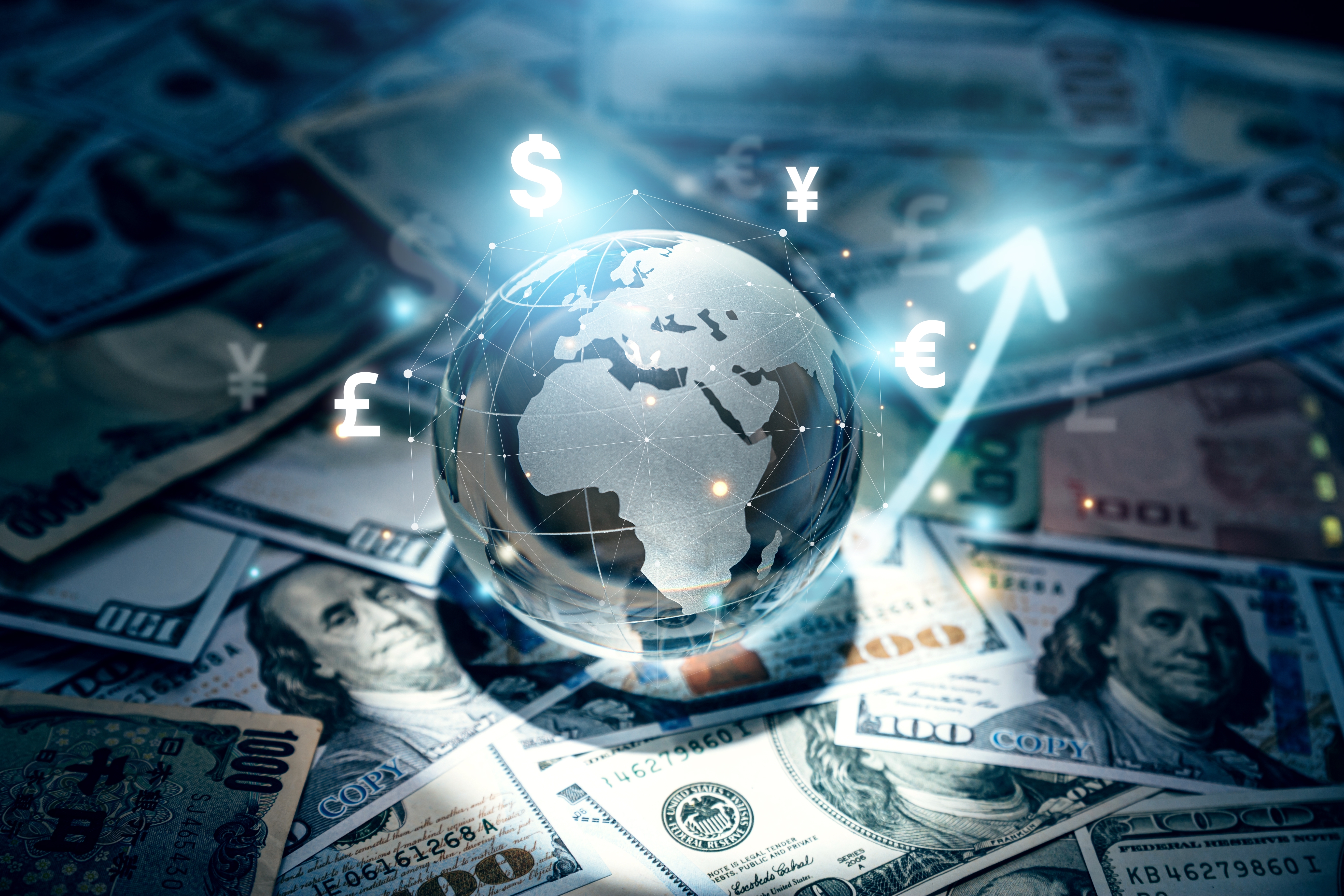 Globe on stack of US dollars