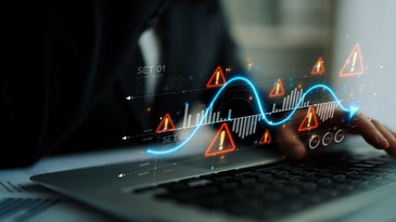 holographic price chart with warning sign over a keyboard