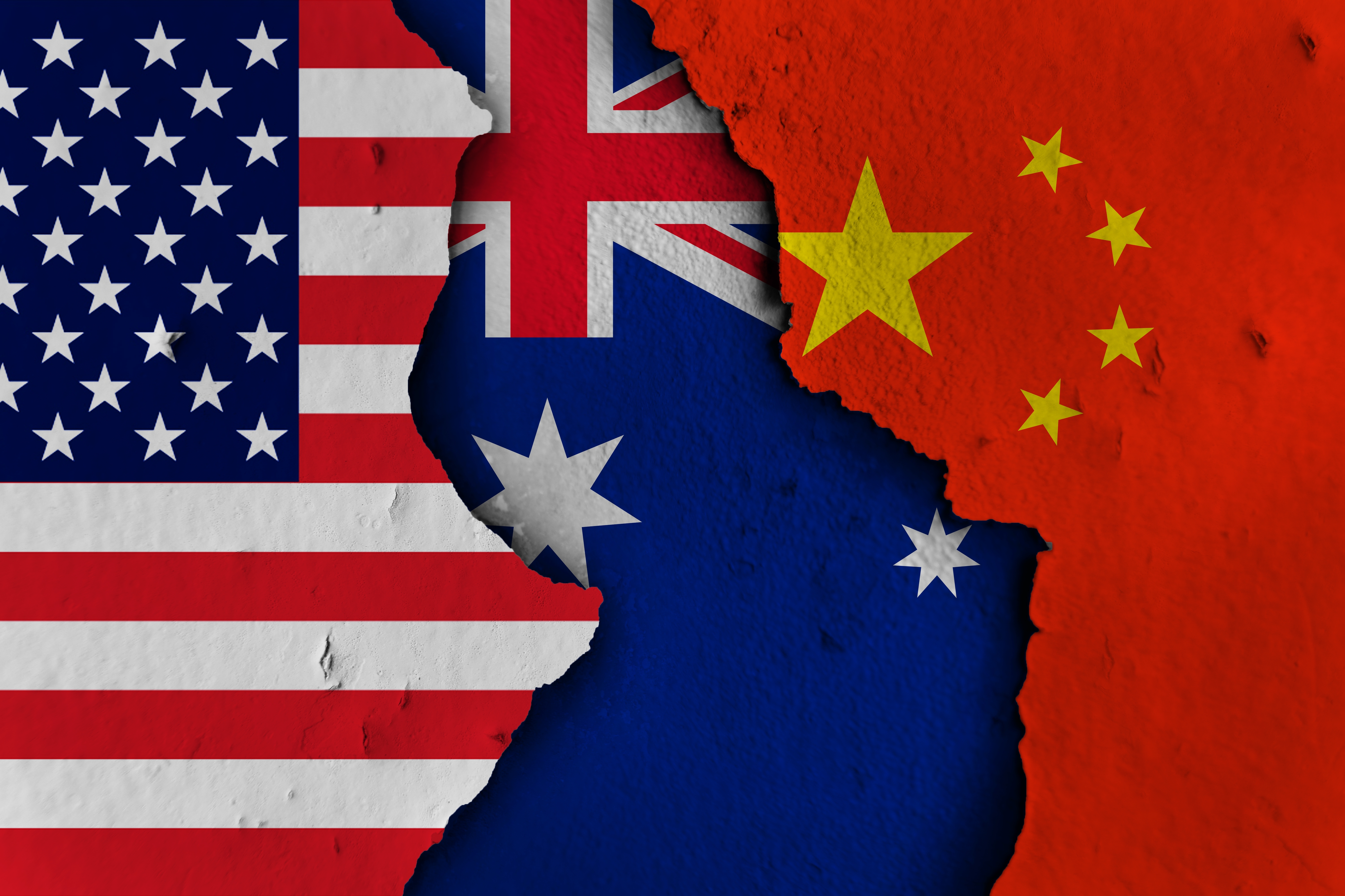 US, Australia, and China flags overlaid