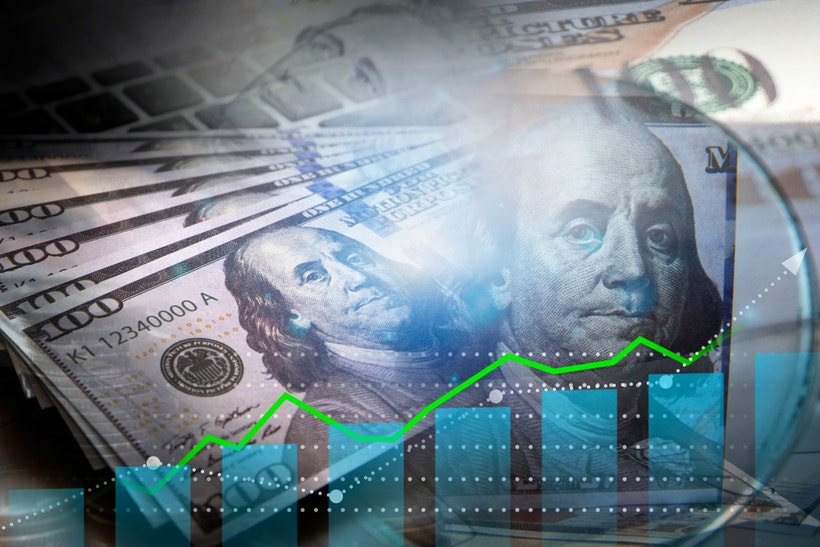 US dollars with graph rising