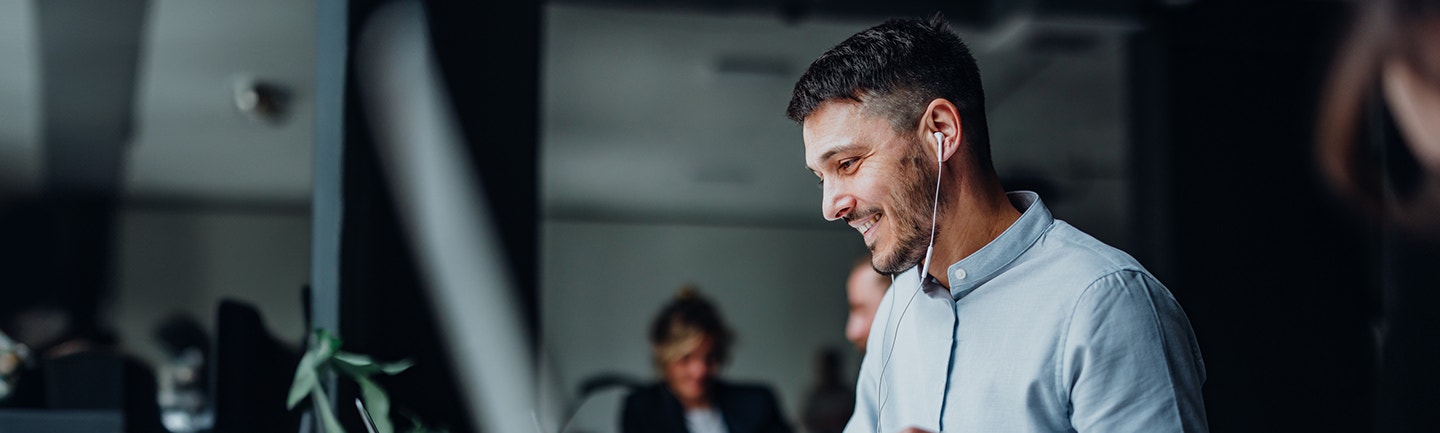 Man smiling at screen