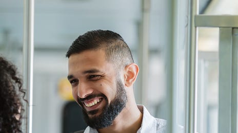 Man talking to his friend after his Arabic class with Berlitz Algeria