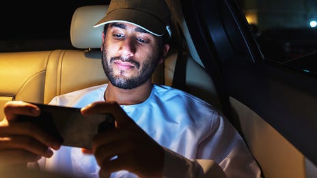 Man attending an online Spanish class with Berlitz Algeria from his phone