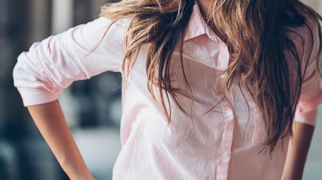Woman smiling before taking a TOEFL exam preparation course with Berlitz