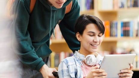 Teenager in a wheelchair attending an online German class with Berlitz Algeria from her tablet