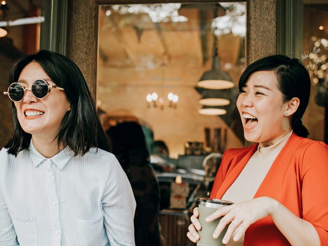 Two women talking in their target language after their language class