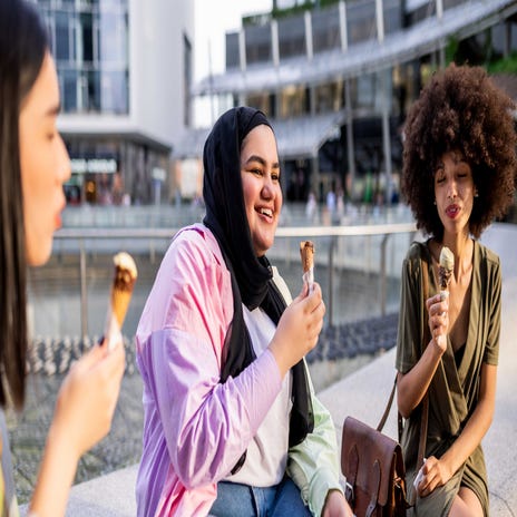 Girls chatting and eating ice cream after their French class with Berlitz Algeria