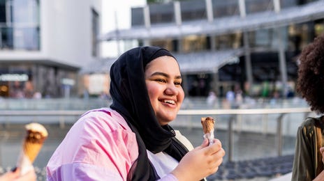 Girls chatting and eating ice cream after their French class with Berlitz Algeria