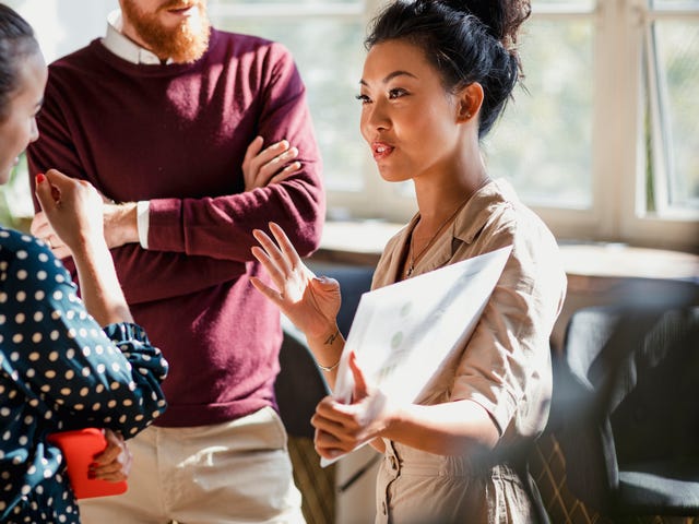 Group of students discussing the material during an IELTS exam preparation course