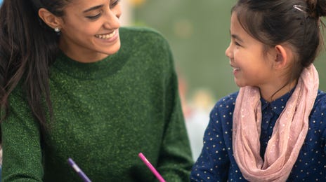 Girl and her instructor during a private language class with Berlitz learning a new language