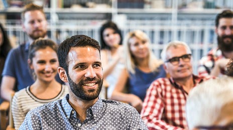 A group of employees attending a business seminar with Berlitz Algeria