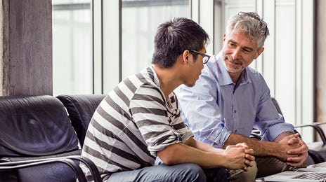 Student talking to his instructor during his intensive English class at Berlitz Algeria