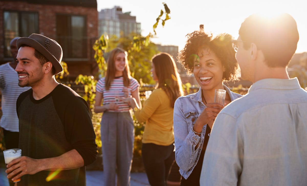 Woman in a party chatting in English after her English class for beginners with Berlitz Algeria