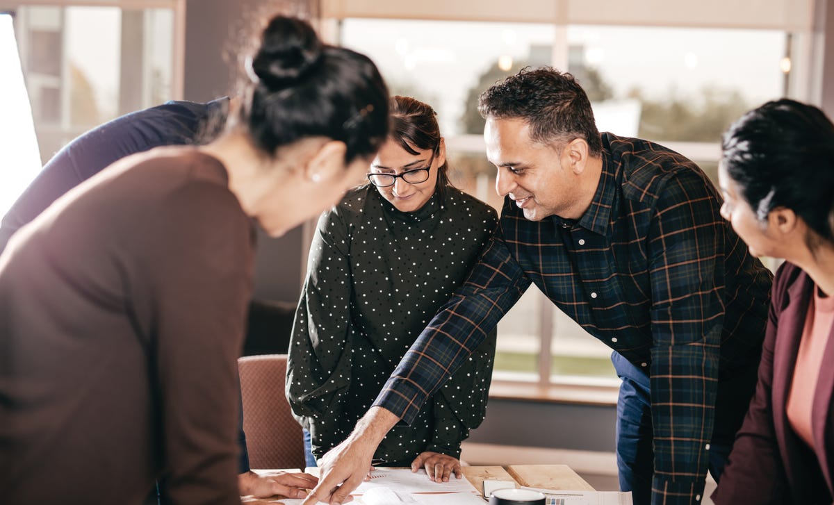 Students and their instructor talking to each other during a group language class at Berlitz Algeria