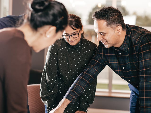 Students and their instructor talking to each other during a group language class at Berlitz Algeria