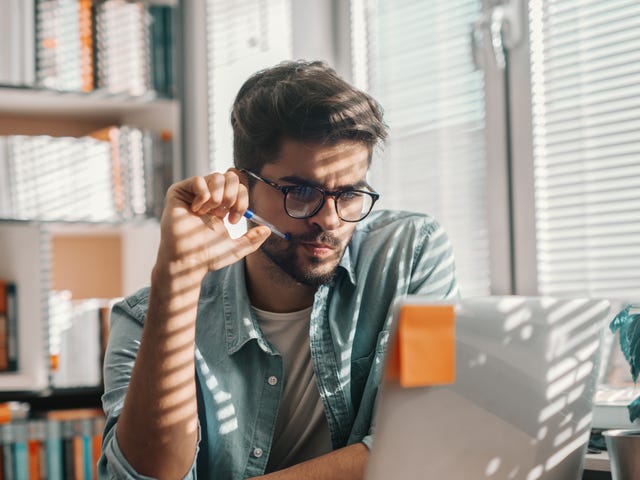 Man learning German on his laptop with Berlitz Algeria