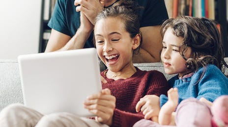 Kids and their dad taking an online Spanish course with Berlitz Algeria