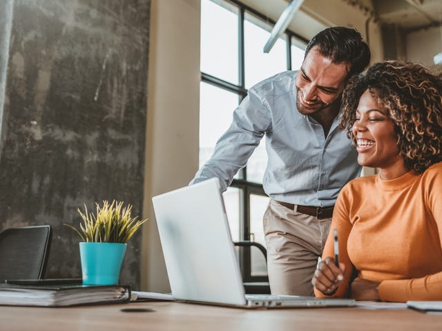 A man and a woman in an intensive language class that is personalised to fit the needs of the student