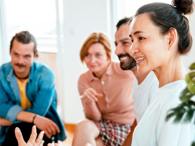 Group of students talking to each other in a foreign language during a class with Berlitz Algeria
