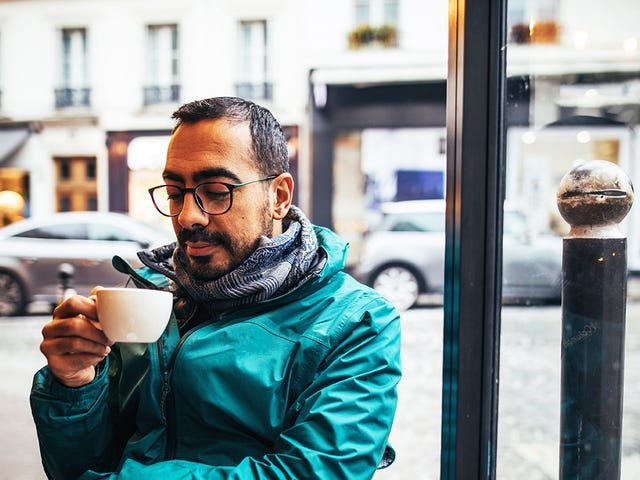 Man drinking coffee in a coffeeshop before his intensive language class with Berlitz Algeria