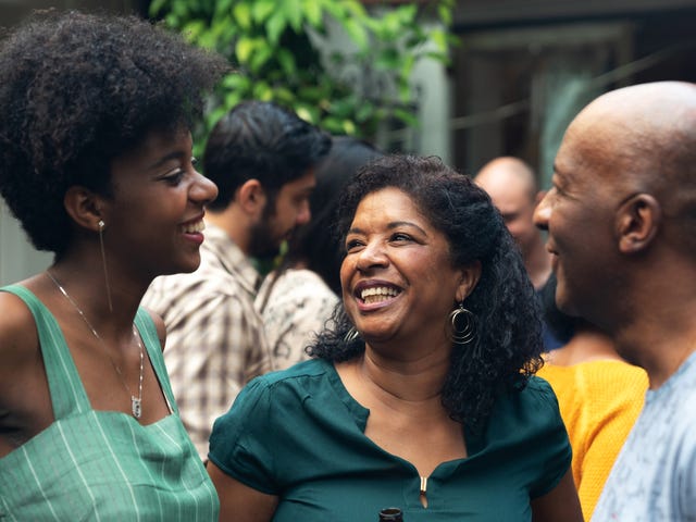 People in a family gathering discussing group language courses