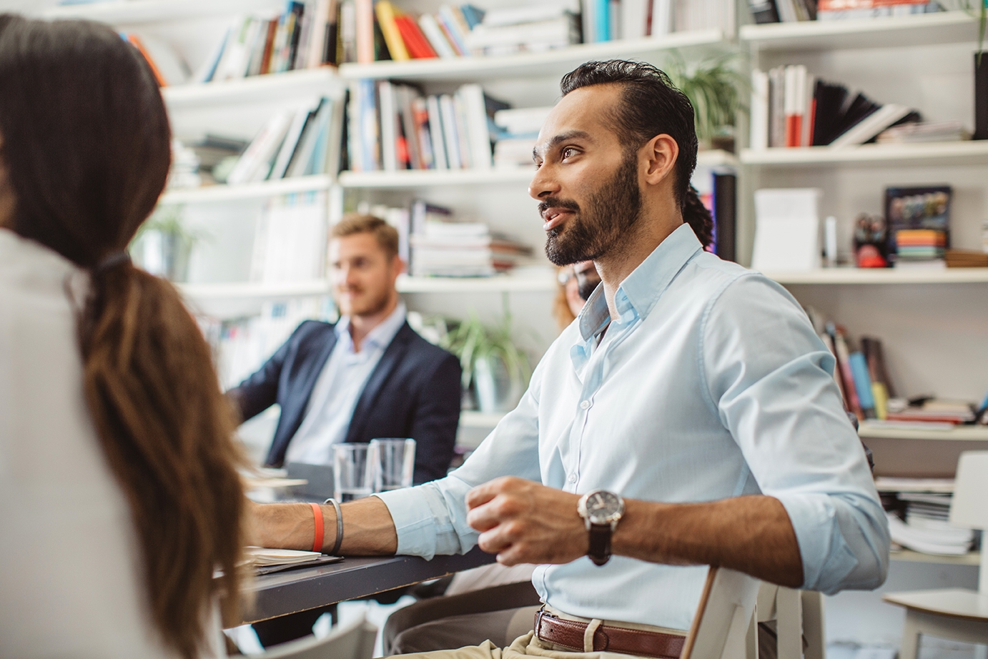 Man taking an international management class in a group setting with Berlitz Algeria