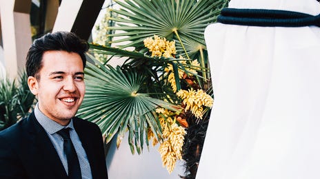 Men shaking each other's hands before their intensive French class with Berlitz Algeria