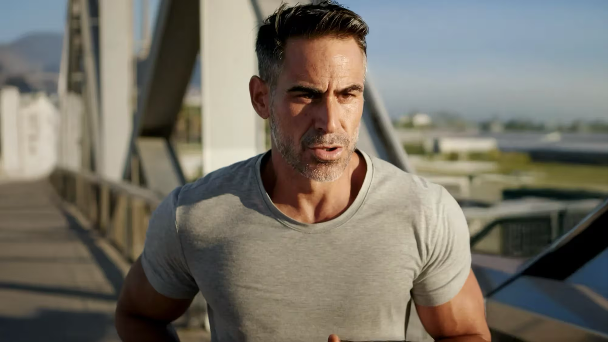 Man running on a bridge Man running on a bridge