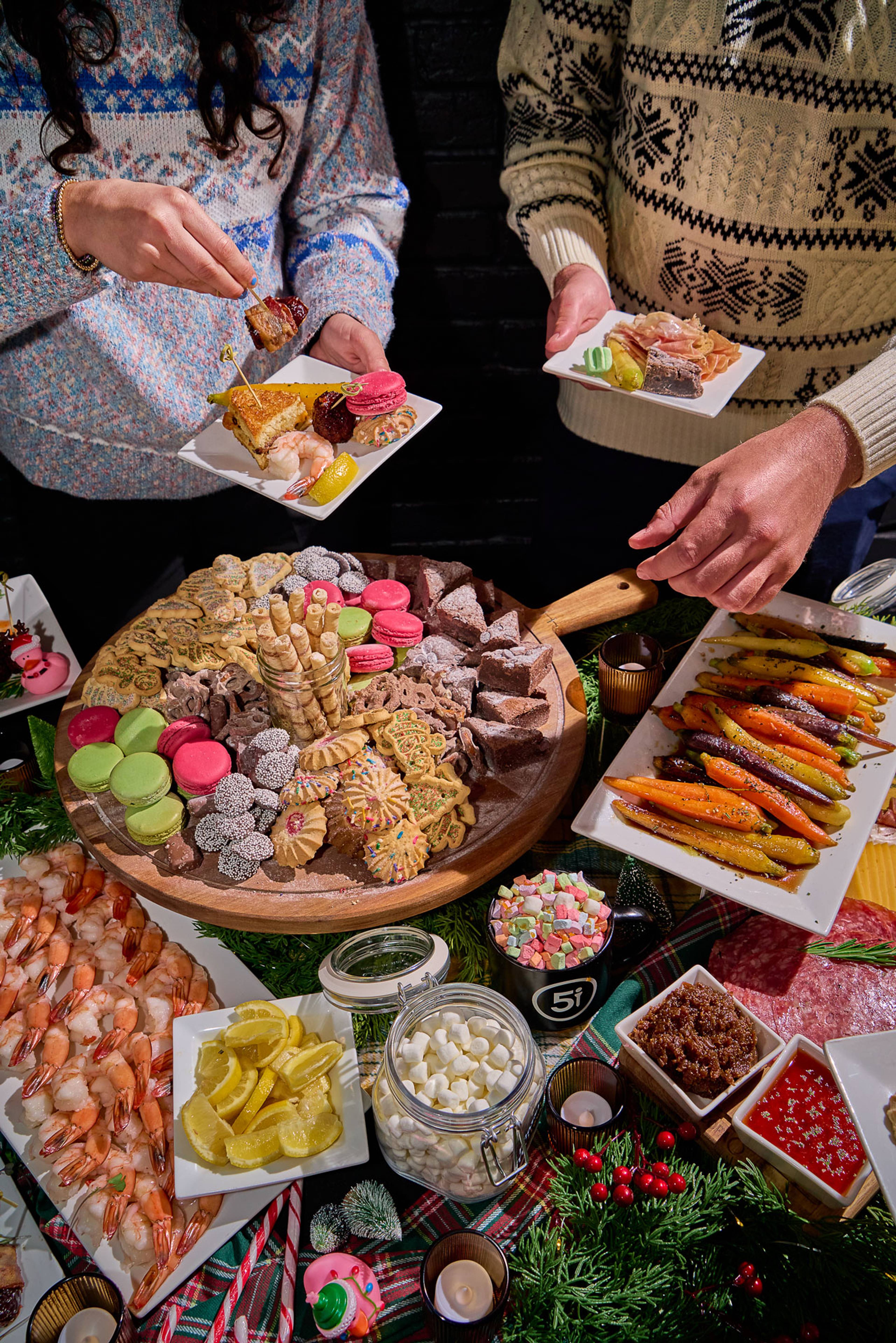 Holiday charcuterie and dessert spread at a Five Iron Golf event