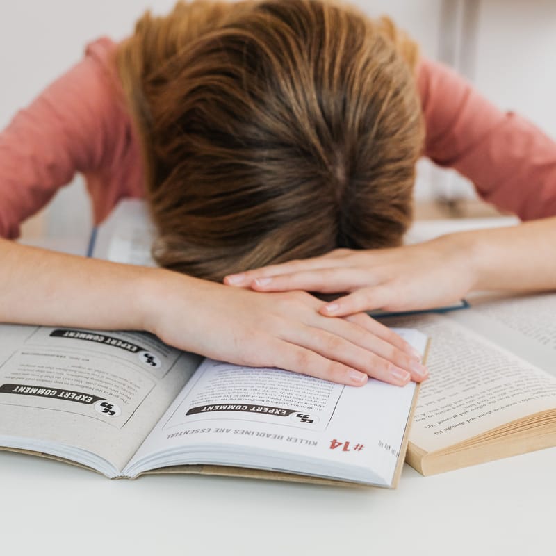 Adult studying on a laptop during a Berlitz online language-learning session.