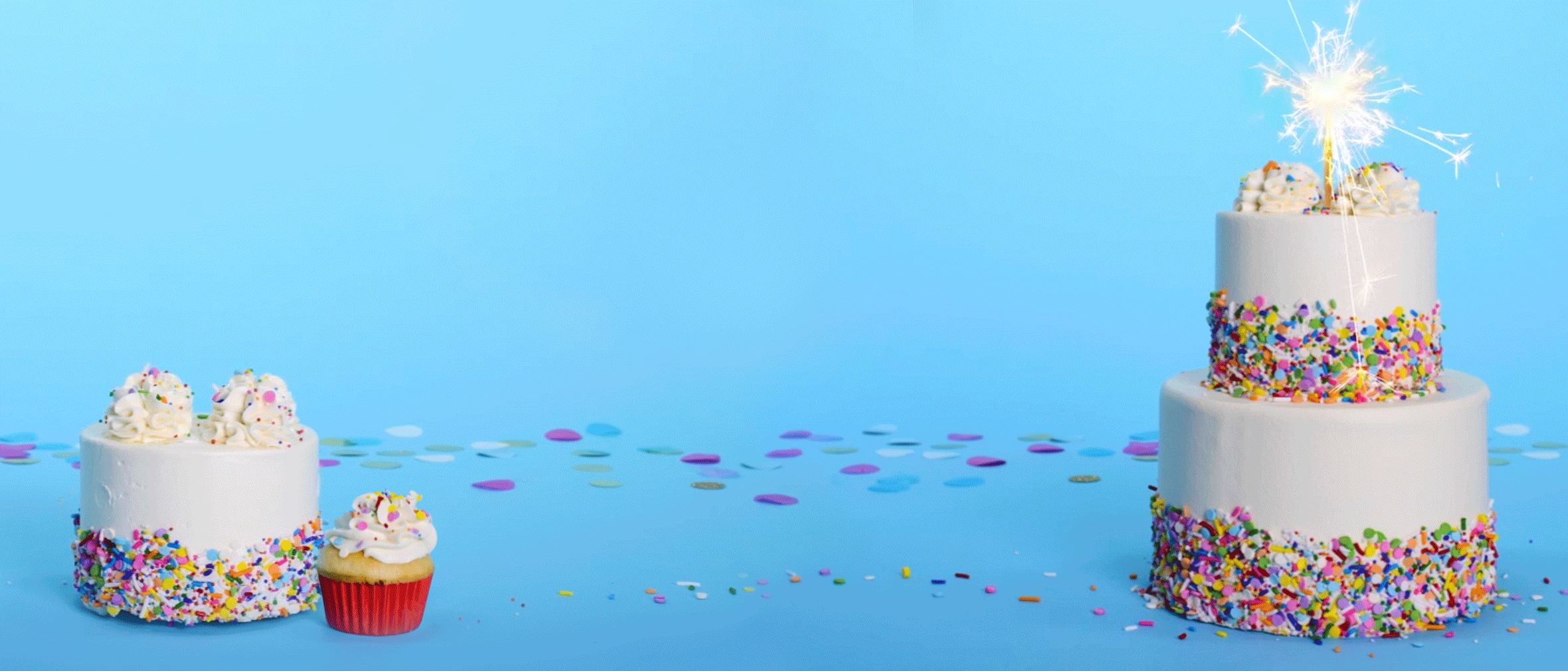 A birthday cake with a sparkling candle