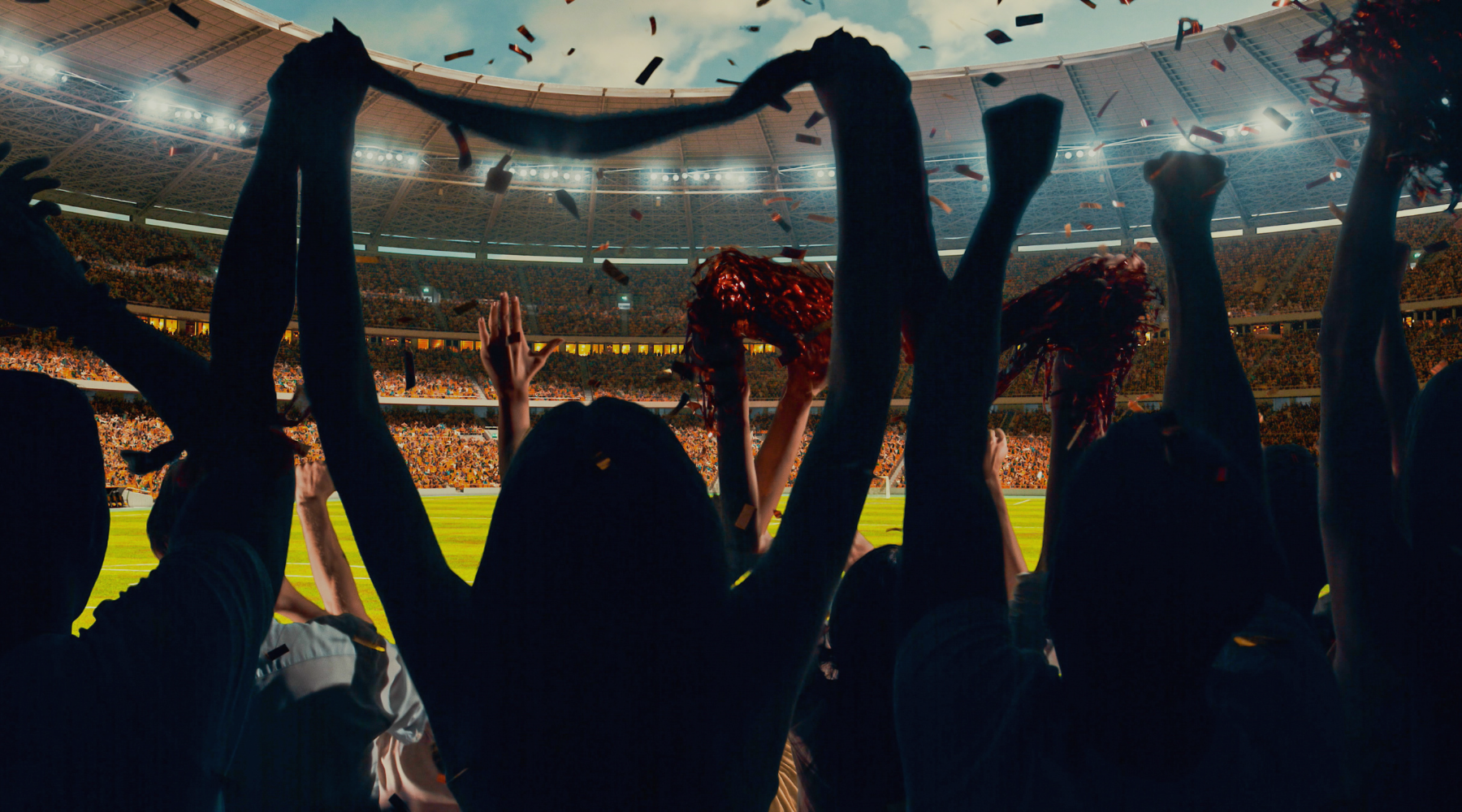 Football supporters cheering after a goal at a stadium during a Berlitz cultural immersion lesson.