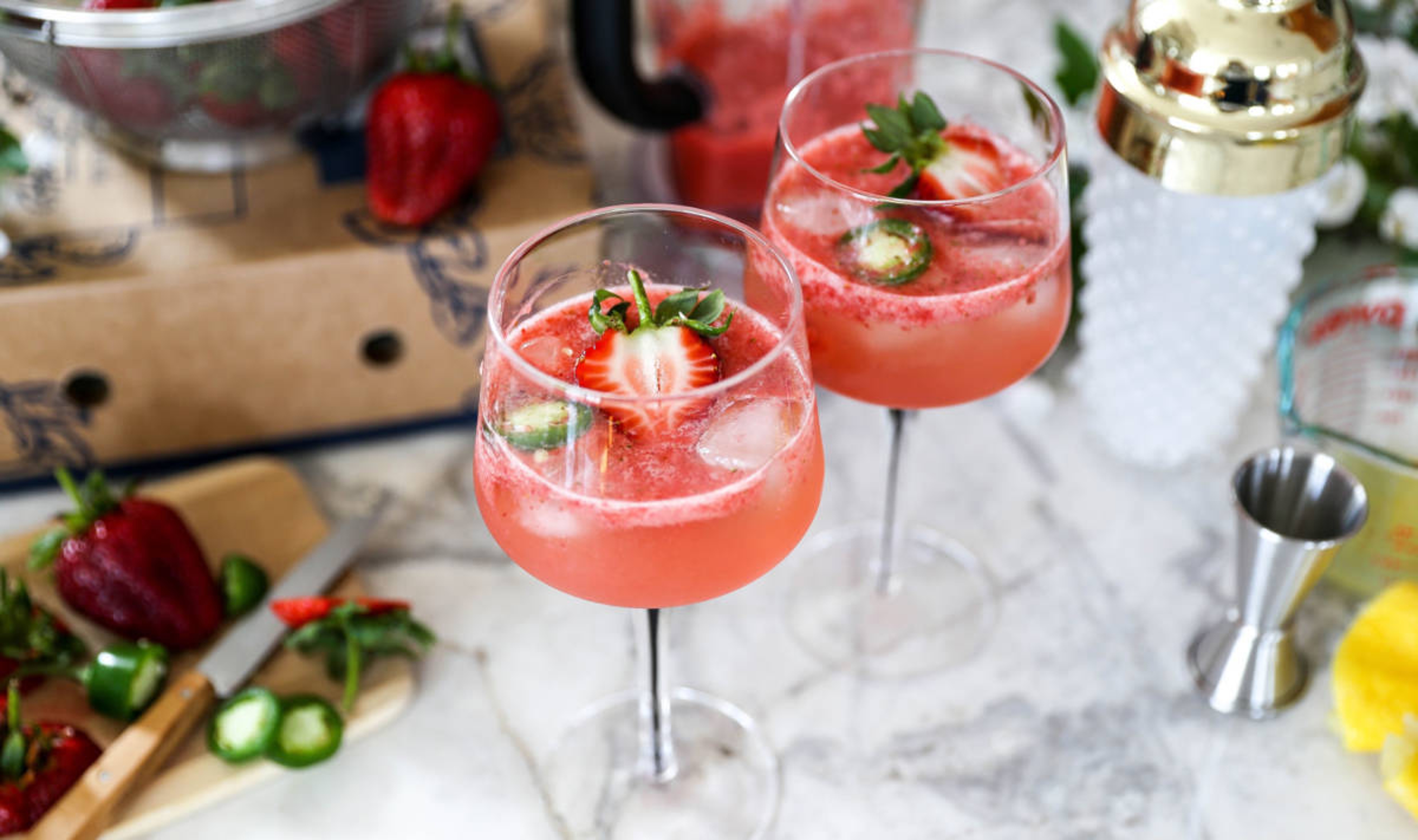 Strawberry cocktail with jalepeño slices and lemon juice