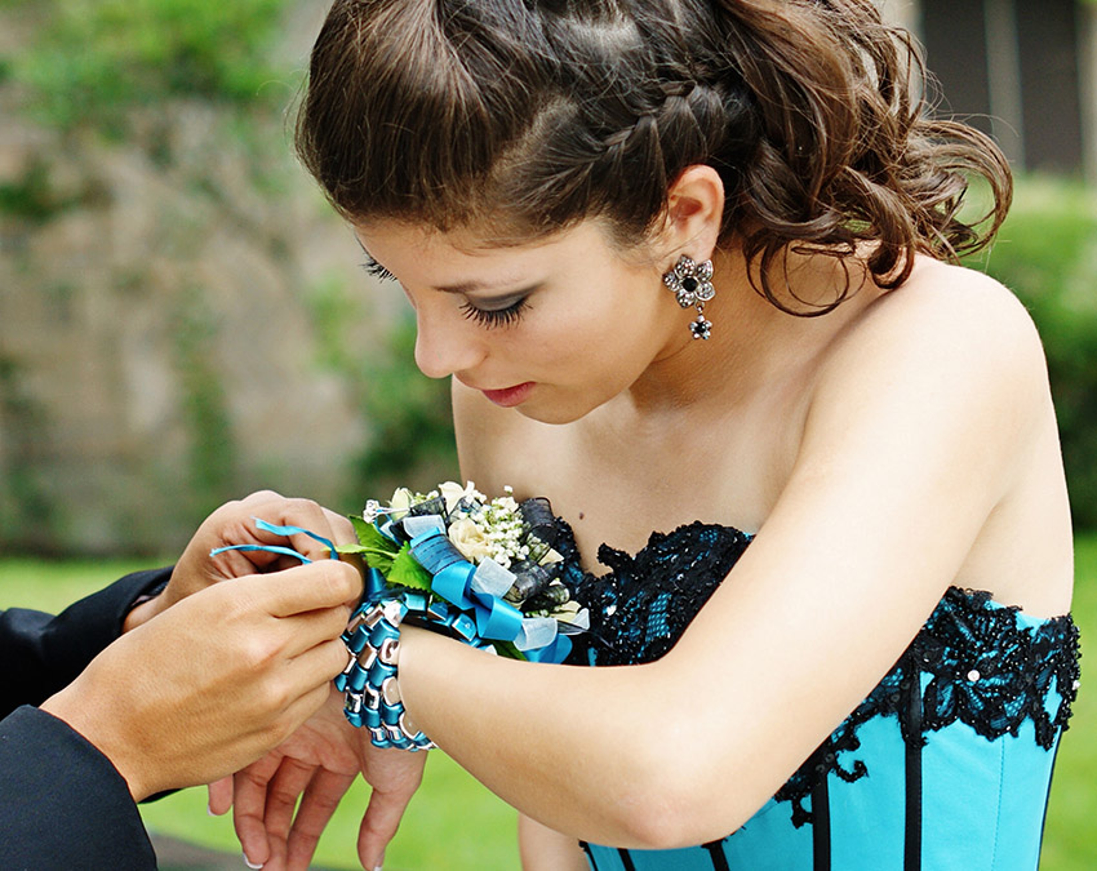 High school couple getting ready for their Senior Prom .