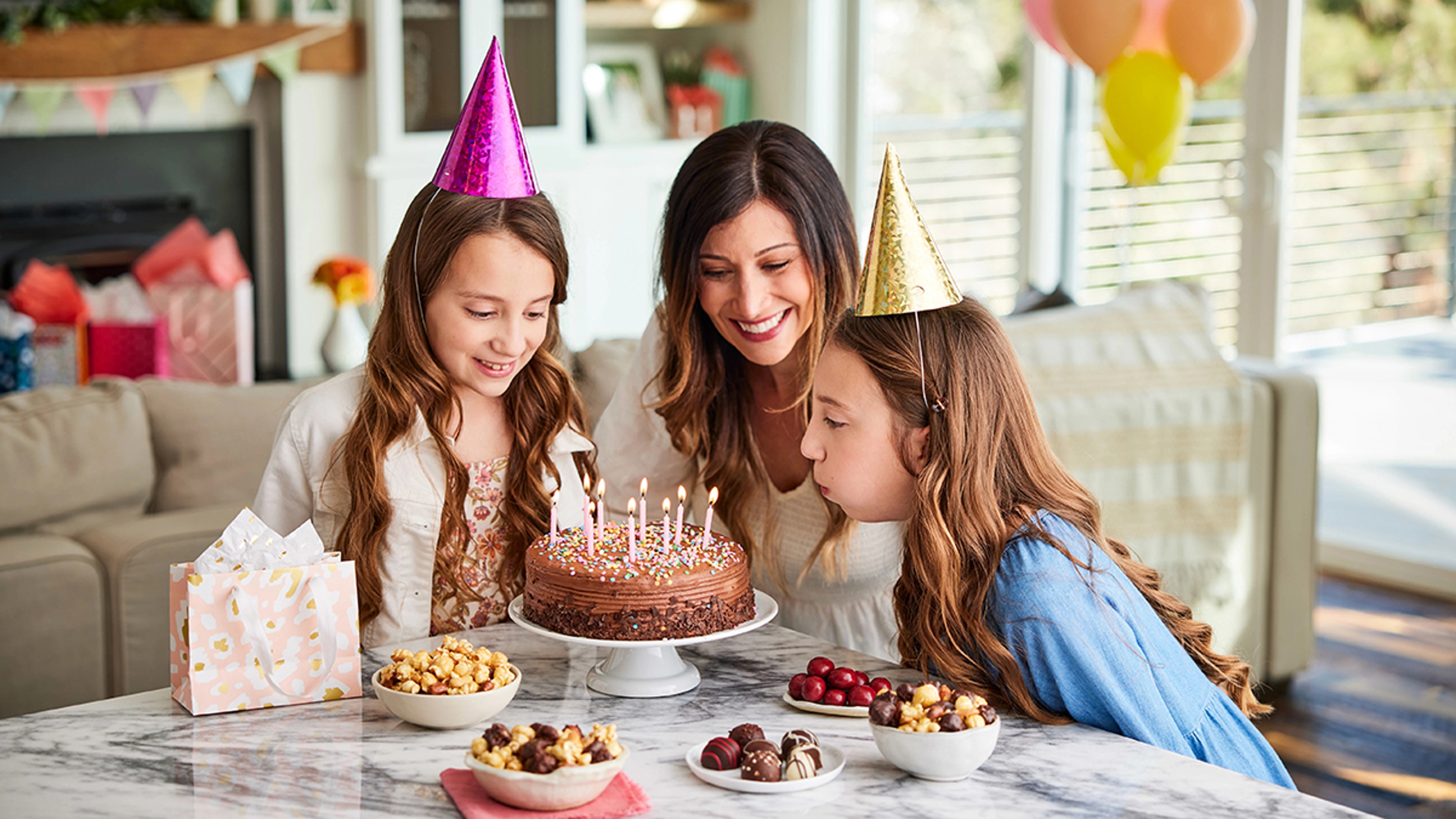 Article Cards Featured Image june birthdays girls blowing out candles