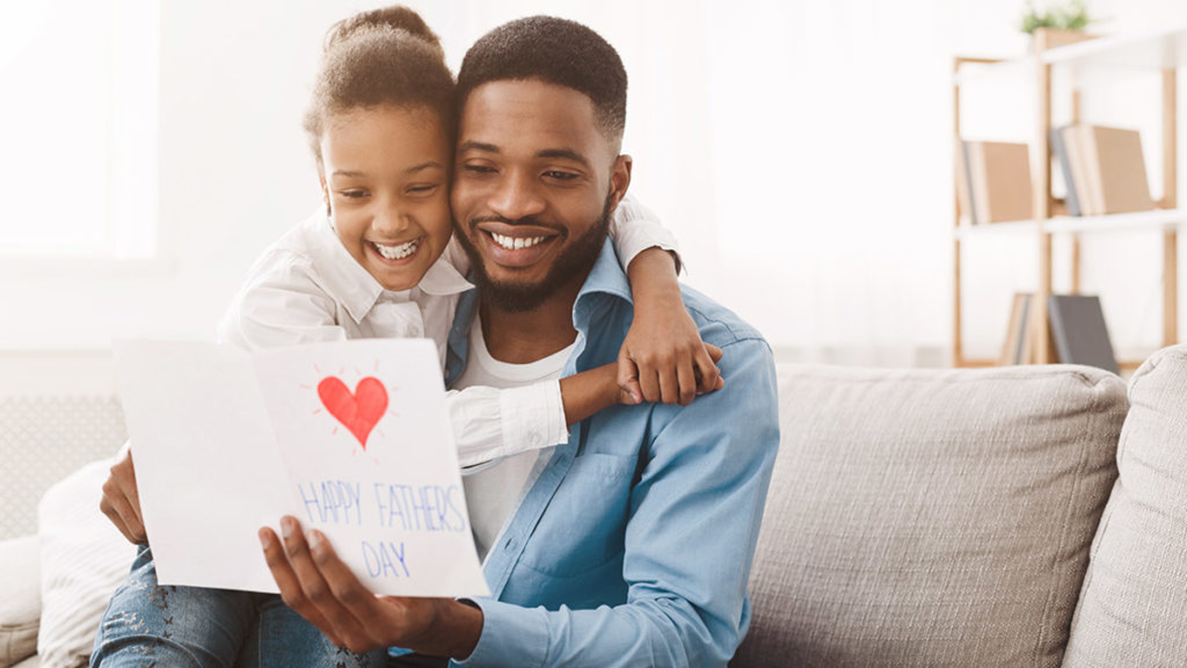 daughter giving dad fathers day card x