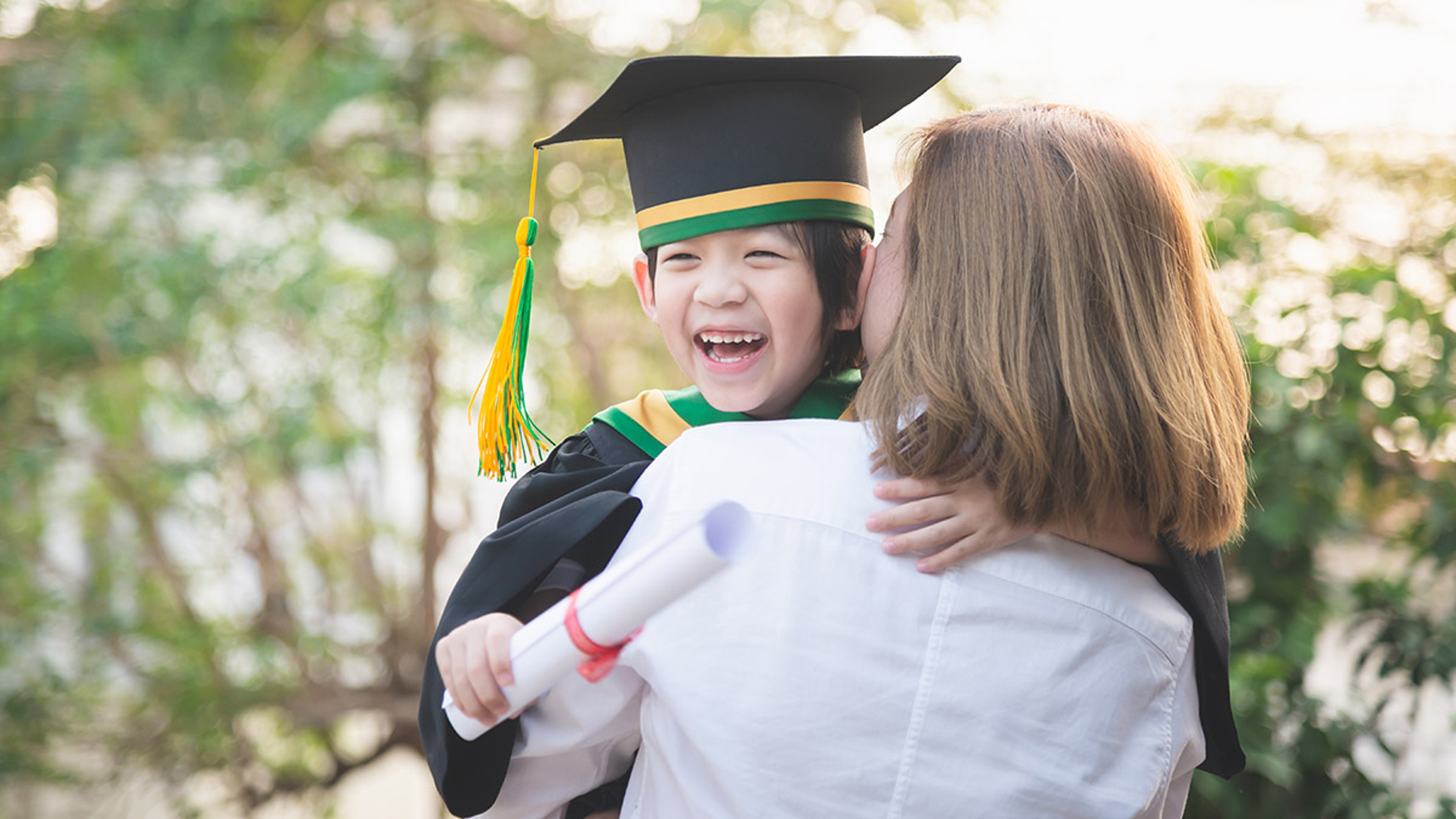 Article Cards Featured Image Asian mother embracing her son on graduation day