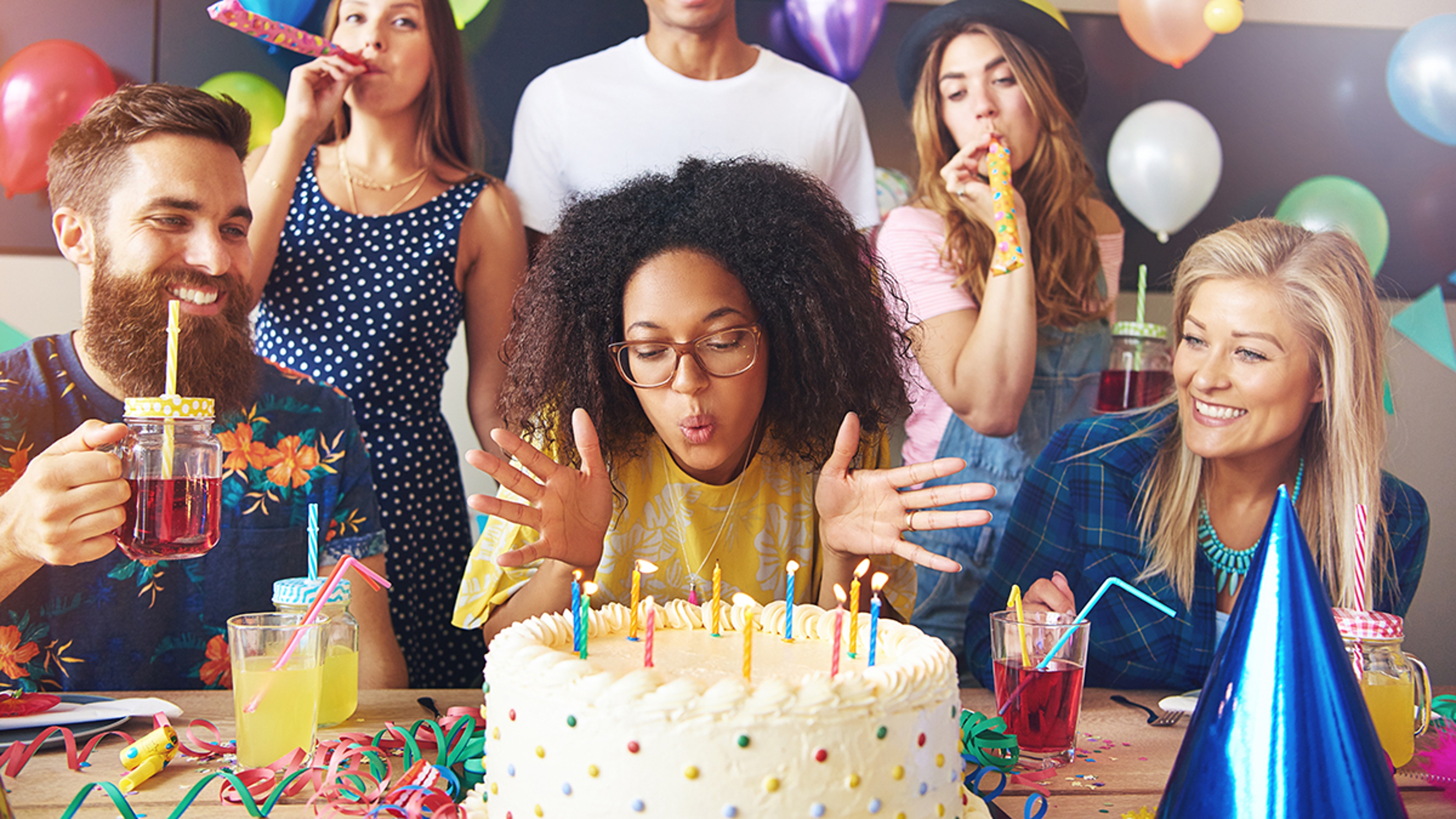 Article Cards Featured Image woman blowing out candles