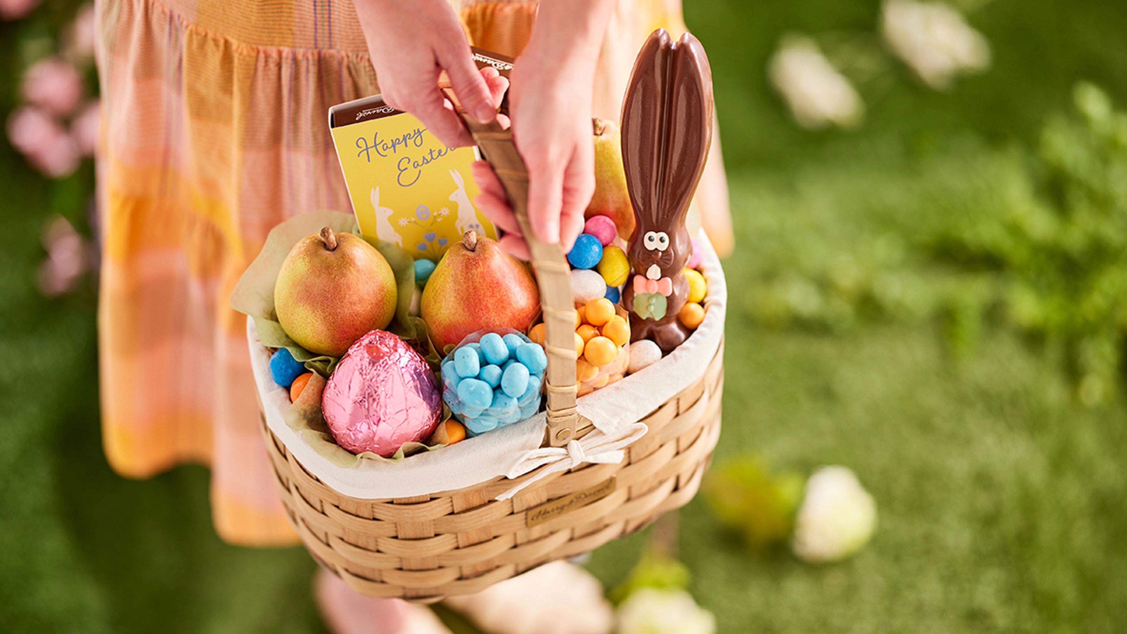 Easter facts with a basket of Easter candy and pears.