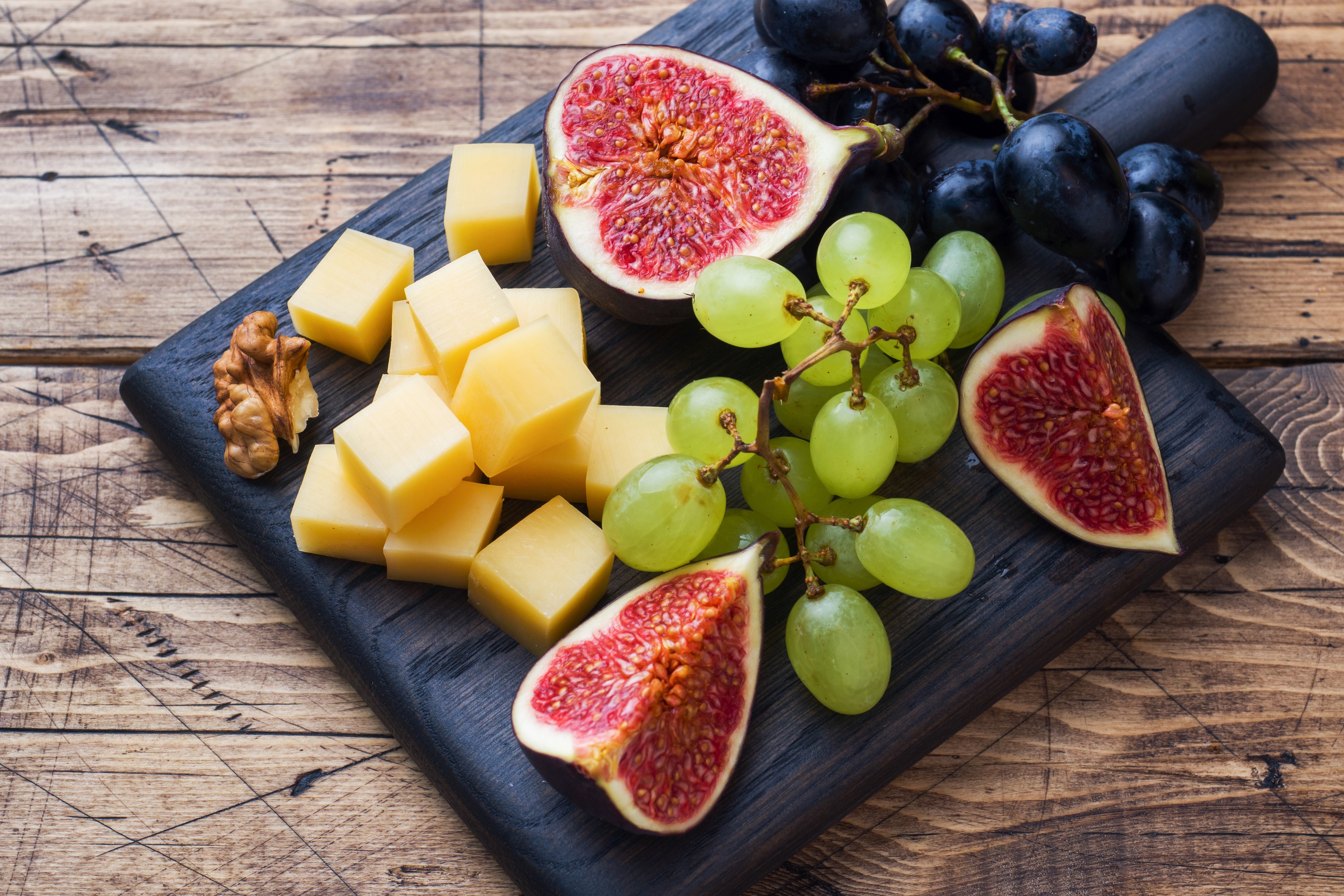 romantic foods figs plate with cheese grapes