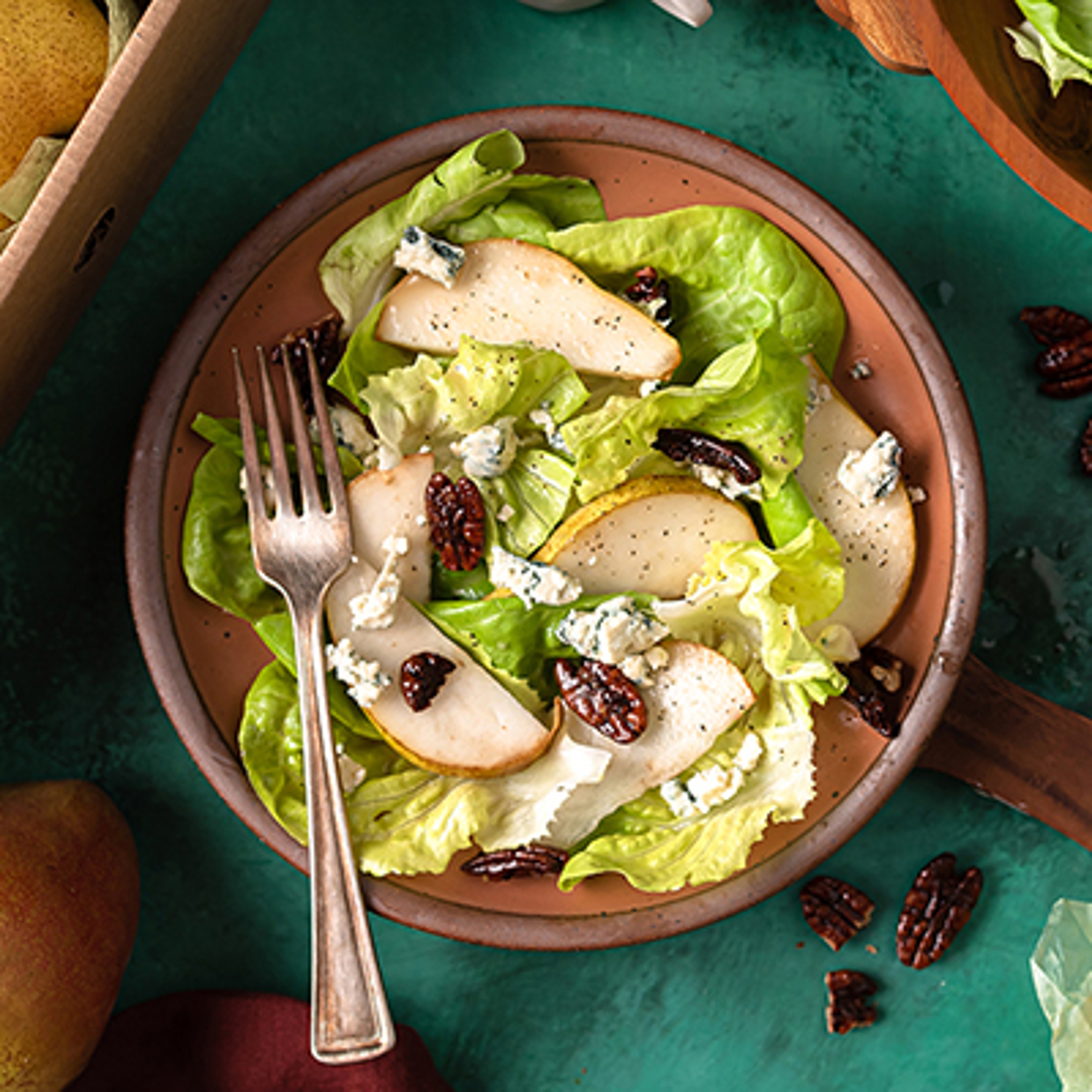 Pear and blue cheese salad in a bowl.