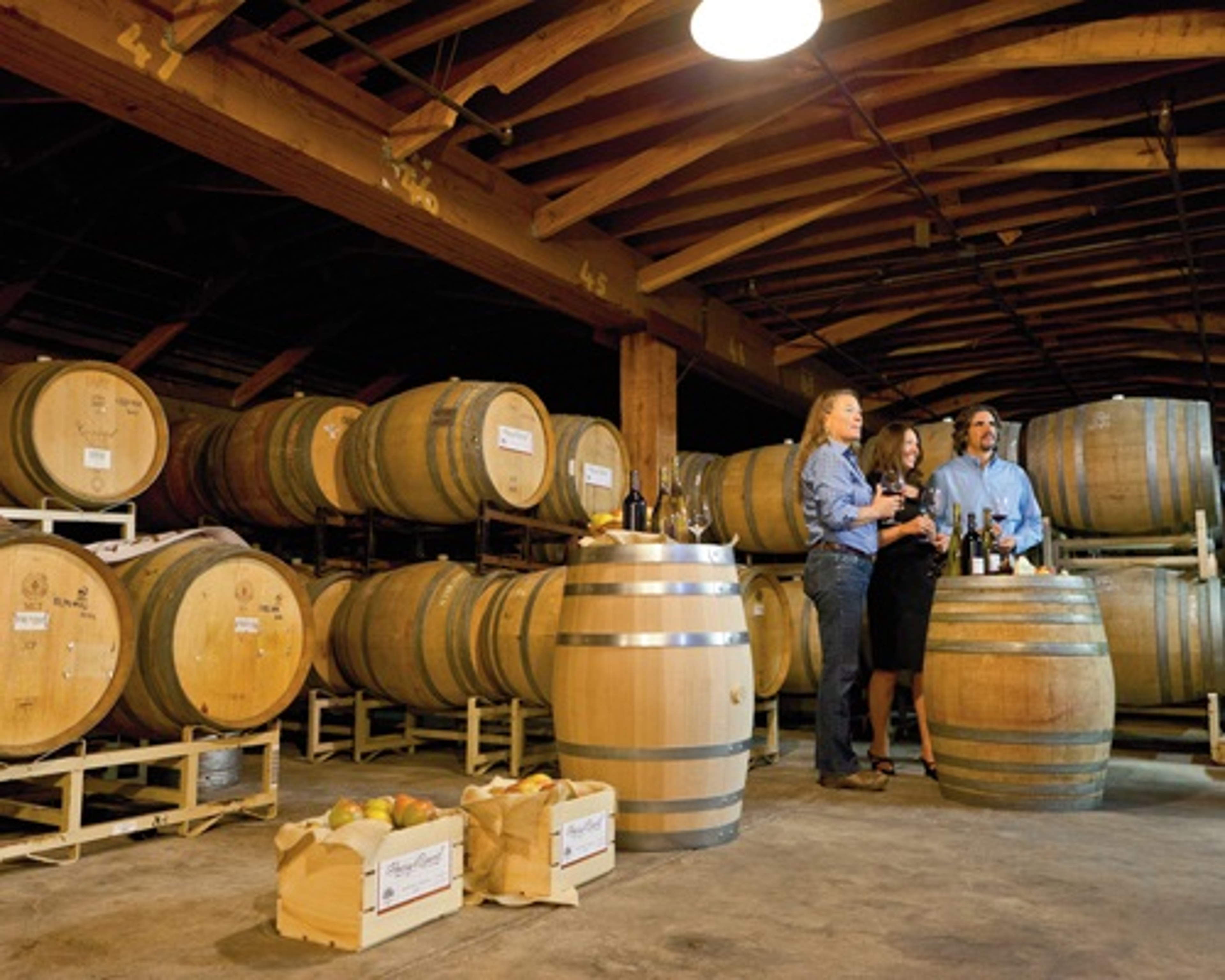 Harry & David's winemaker Linda Donovan and guest at the new wine crush facility.