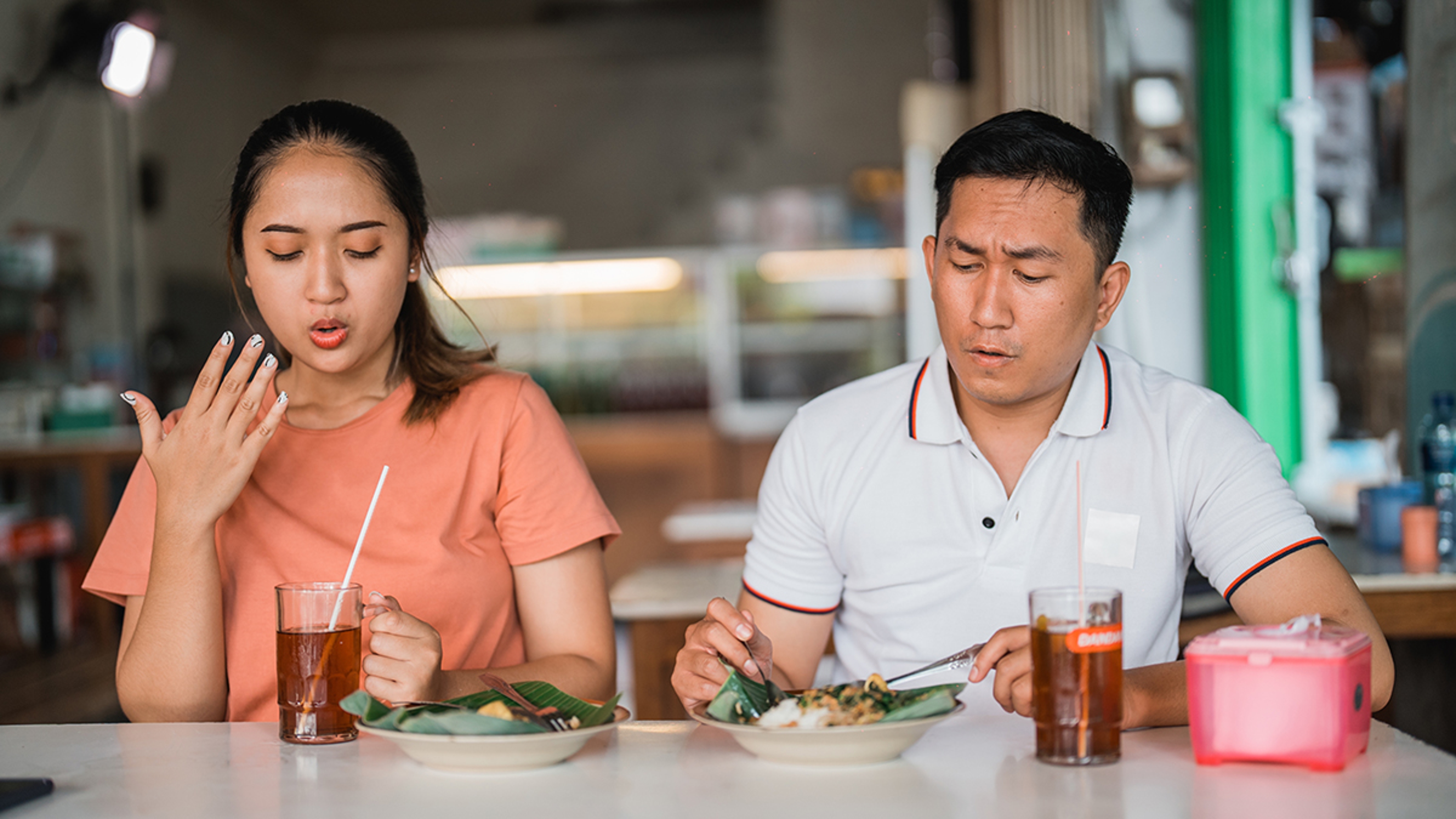Couple eating spicy food.